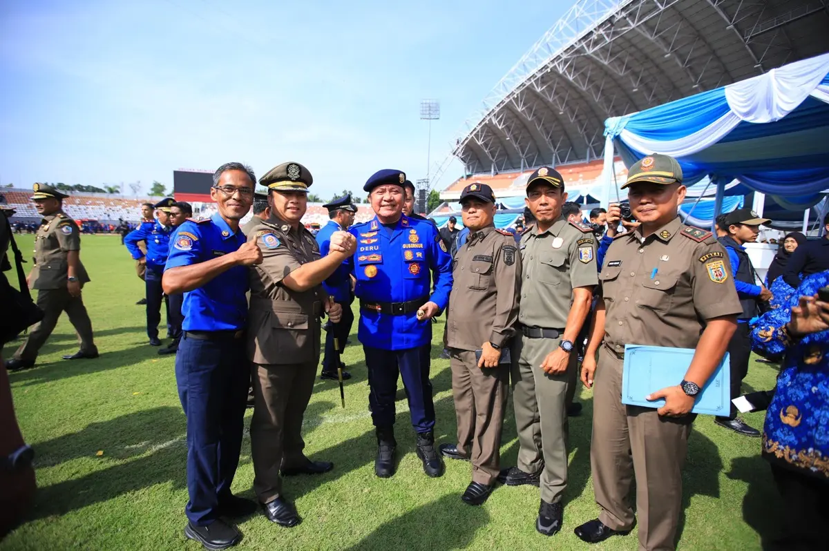 Ribuan personel mengikuti upacara HUT Damkar, Satpol PP, dan Satlinmas 2026 di Jakabaring. (MUSINEWS.ID/TRI)