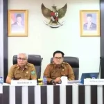 Rapat Koordinasi Lintas Sektor Program JKN UHC yang dihadiri Asisten II Bidang Perekonomian dan Pembangunan Setda Kota Prabumulih, Wawan Gunawan, Ak., CA., mewakili Wali Kota Prabumulih, H. Arlan.